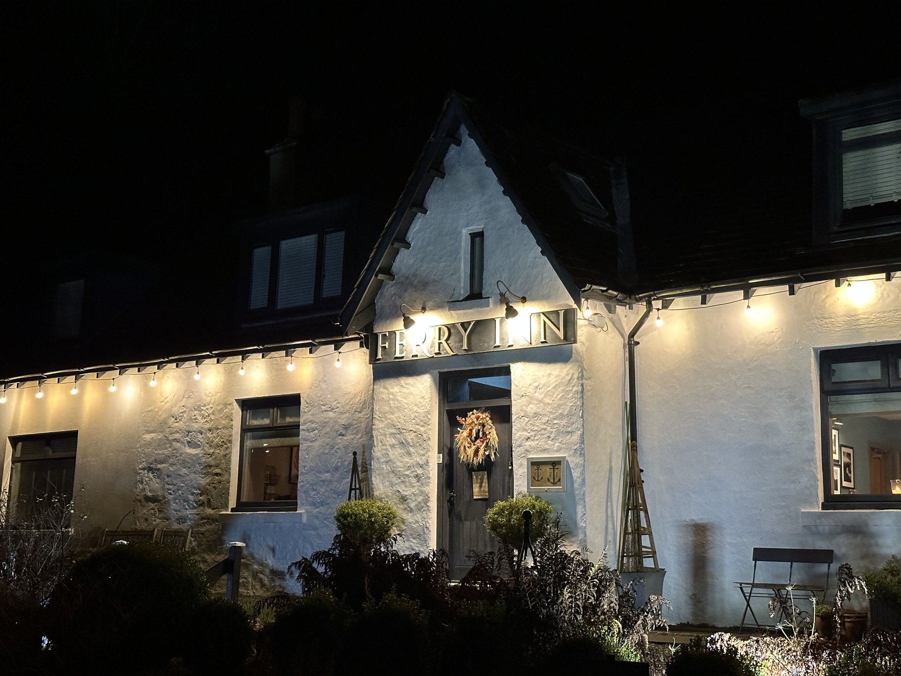 The Ferry Inn, Uig, lit up in the evening