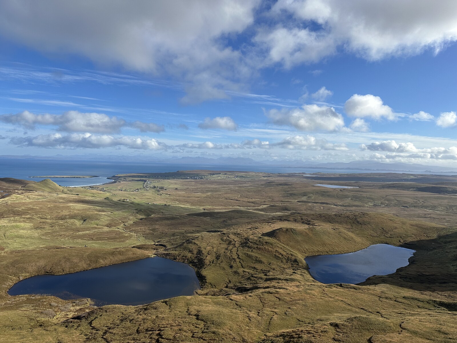 High view over lochs and the coast from the Quiraing plateau