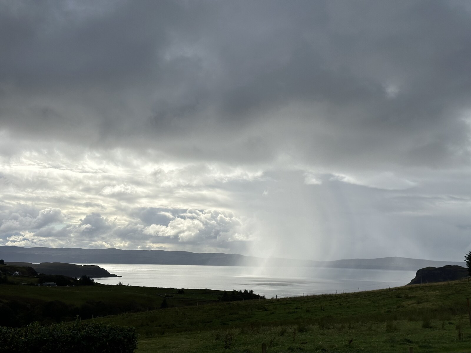 A rain squall crossing the sea near North Skye